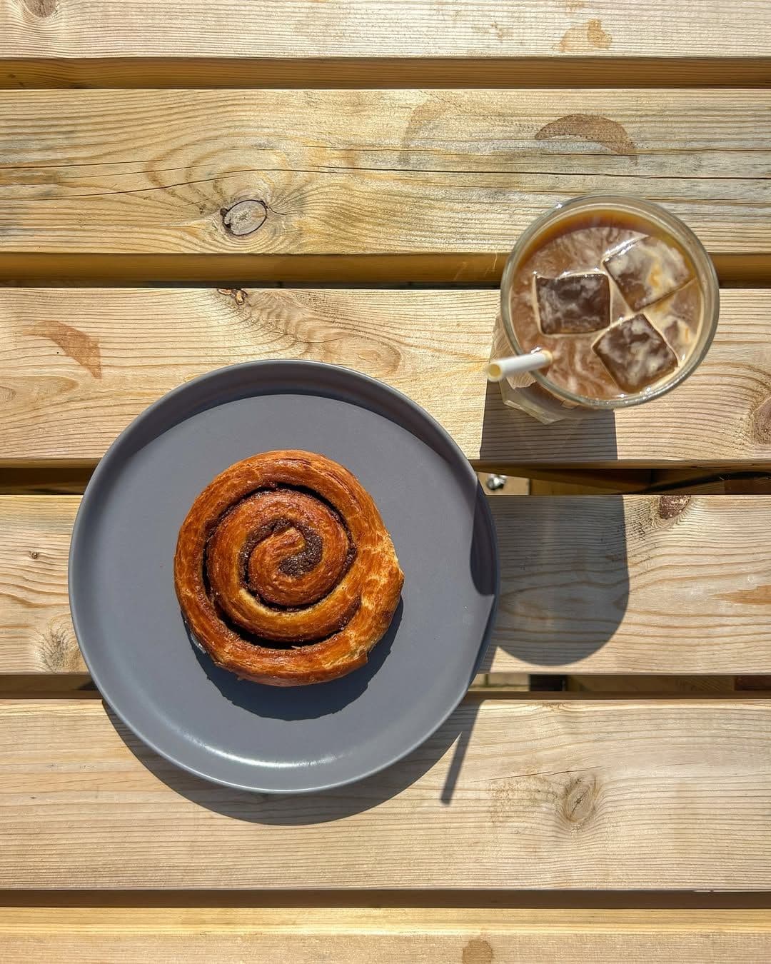 ice latte and cinnamon roll